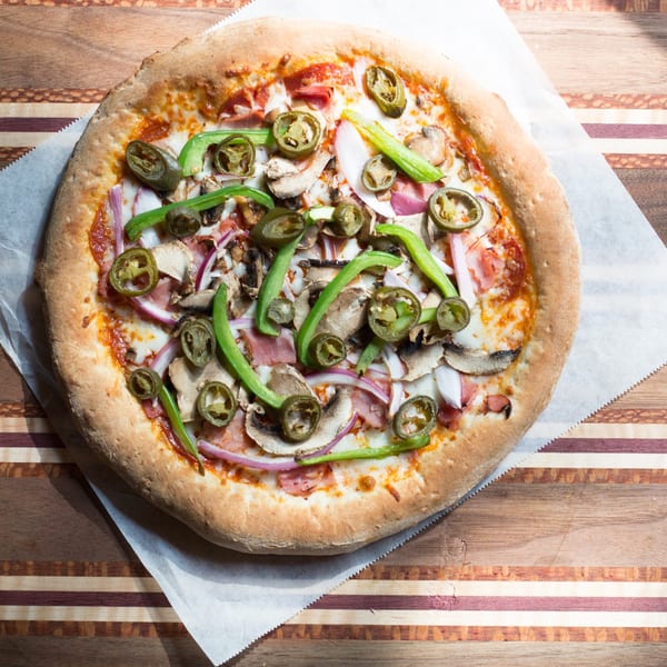 DaVinci's Pizzeria pizza with jalapeños, green peppers, mushrooms, red onions, and ham.